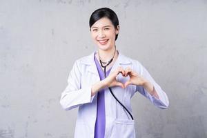 Portrait of young Asian female doctor photo