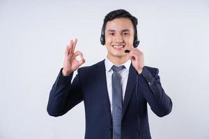 Image of young Asian businessman on background photo