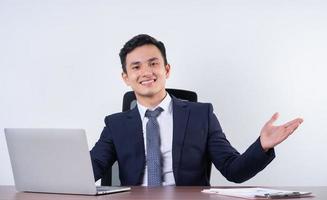 Image of young Asian businessman on background photo