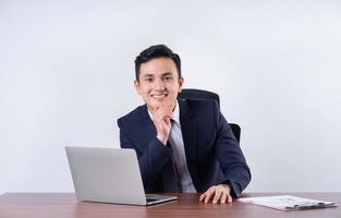 Image of young Asian businessman on background photo