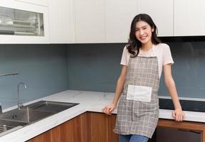 Image of young Asian woman at home photo