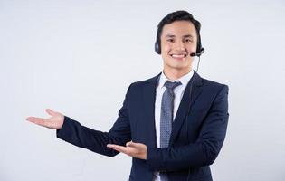 Image of young Asian businessman on background photo