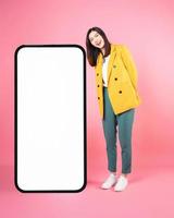 Image of young Asian businesswoman with smartphone mock up photo