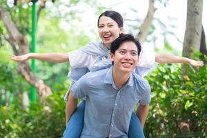 Image of young Asian couple outside photo