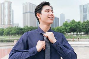 Photo of Asian businessman outdoors