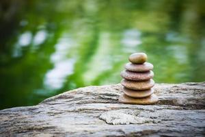 Stack of zen rocks in garden photo