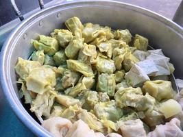 dumplings in a saucepan. street food snacks photo