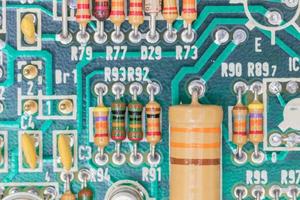 Condensers and Resistor assembly on the circuit board photo