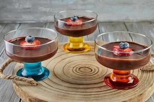 Pesach special chocolate cream with strawberries and blueberries photo