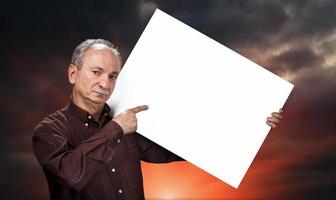 man holding billboard photo