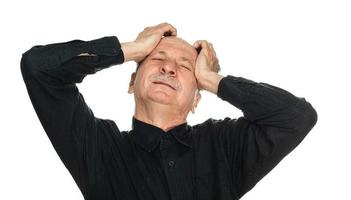 Elderly man suffers from headache photo