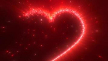 gloeiend rood liefde hart gemaakt van deeltjes Aan een rood feestelijk achtergrond voor Valentijnsdag dag. video 4k, beweging ontwerp