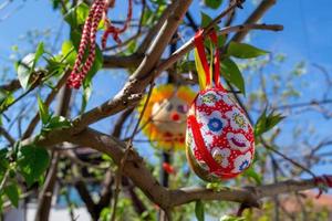 Easter Eggs on the trees. Traditional bulgarian national decoration for Easter. photo