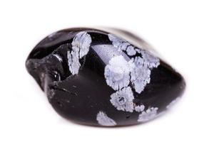 Macro mineral stone snow obsidian on white background photo