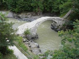 Arch bridge of queen Tamara across Adzhariszkhali river in Adjara, Georgia photo