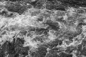 river water flow background - black and white stock photo