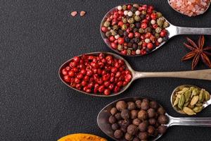 Composition consisting of variations of spices in white bowls and metal spoons photo