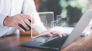 Businessman Audit documents, quality assessment management With a checklist, business document evaluation process, market data report analysis and consulting, plan review process. photo
