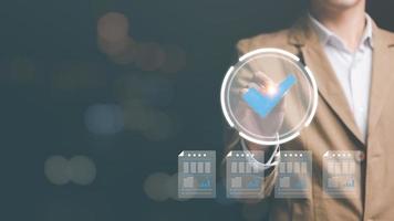 Businessman Audit documents, quality assessment management With a checklist, business document evaluation process, market data report analysis and consulting, review process correctness of document photo