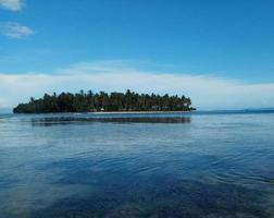 Island on ocean mirror view photo