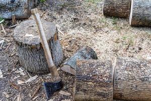 Photography on theme big steel axe with wooden handle photo