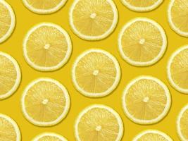 Lemon slices texture on yellow background photo