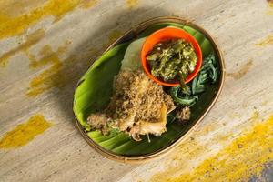 Delicious fried green chili chicken with added fresh vegetables photo