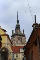 Different angles showing the upper part of the clock tower in Sighisoara photo