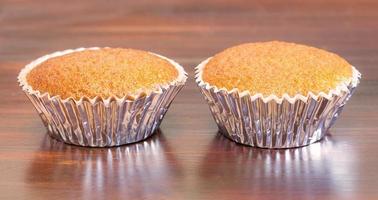 Banana cupcake on wooden table photo