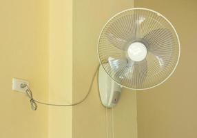 electric fan on the wall photo