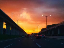 Jakarta, Indonesia in July 2022. Dusk on the road in Jakarta, where the traffic is quite congested because it coincides with work hours. photo