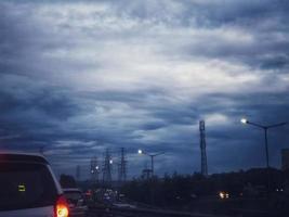 Jakarta, Indonesia in July 2022. Dusk on the road in Jakarta, where the traffic is quite congested because it coincides with work hours. photo
