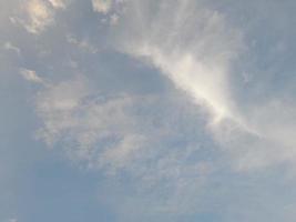 Beautiful white clouds on deep blue sky background. Large bright soft fluffy clouds are cover the entire blue sky. photo