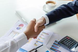 Partnership. two business man investor handshake deal with partner after finishing up business meeting in meeting room office, partner, financial, teamwork, job interview, contract agreement concept photo