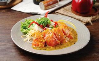 Spiced Fish menu with creamy curry sauce. Steak salmon fish with creamy sauce photo