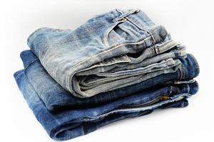 Blue jeans isolated on white background, jeans stacked photo
