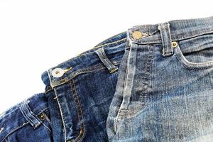 Blue jeans isolated on white background, jeans stacked photo