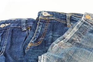 Blue jeans isolated on white background, jeans stacked photo