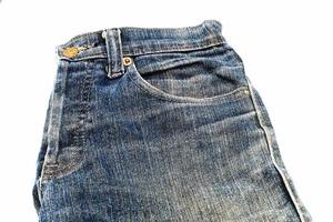 Blue jeans isolated on white background, jeans stacked photo