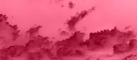 Banner with blue sky inverted and toned into Viva Magenta trendy color. Inspired by Pantone new color of the year 2023. Horizontal long background photo with place for text.