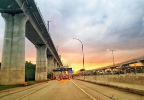 Jakarta, Indonesia in July 2022. Dusk on the road in Jakarta, where the traffic is quite congested because it coincides with work hours. photo