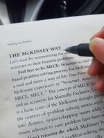 Jakarta, Indonesia in July 2022. A college student is reading The McKinsey Way photo