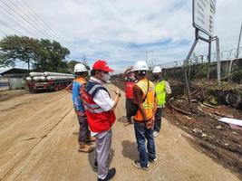 Jakarta, Indonesia in July 2022. Several men holding a project work progress meeting photo