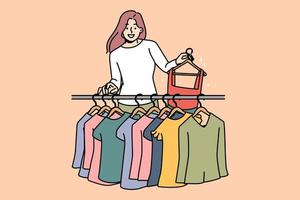 Smiling young woman buying clothes in fashion boutique. Happy female buyer or client choose apparel in shop. Style and consumerism. Vector illustration.