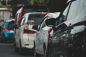 Close up photo of a back lamp of car that stuck in a traffic jam on the highway,