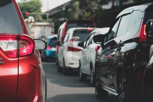 Close up photo of a back lamp of car that stuck in a traffic jam on the highway,