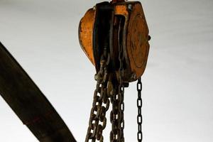 Rusty industrial chain hoist photo