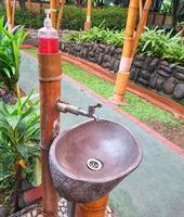 A sink for washing hands made of wood and bamboo photo