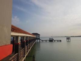 A pier for anchor ships and small boats on a beach called Tirta Samudera Beach or Bandengan Beach photo