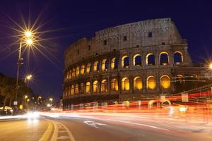 rome, italy, colosseum old ancient building gladiator battle at night. photo